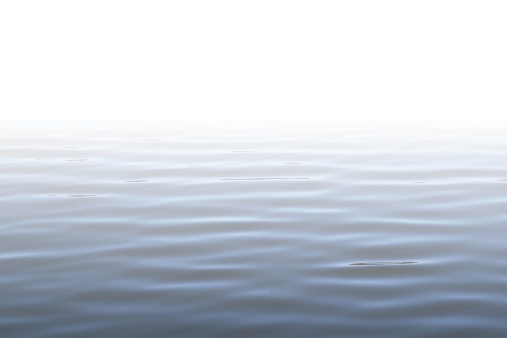 A calm, rippling water surface merges with a bright white sky, creating a peaceful and serene atmosphere in this minimalist landscape.